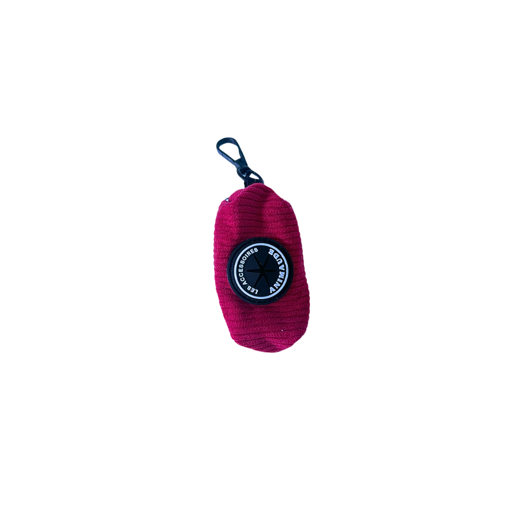 Distributeur magenta de sacs à déchets canins